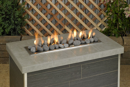 American Fire Products large gray lava stone 2 to 4 inch fire pit media use case in gas fire pit with flames and decorative lava rock