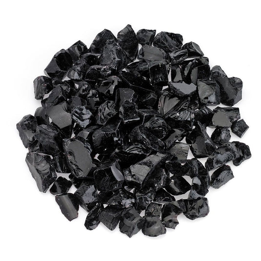 American Fire Products Onyx Medium fire pit glass creating a dark reflective flame display in an outdoor fire pit