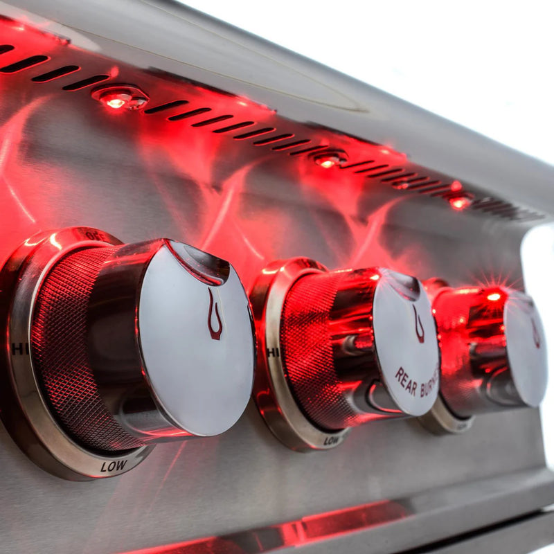 Load image into Gallery viewer, Close-up of control knobs on Blaze Professional LUX 44-Inch 4-Burner Built-In Gas Grill with Rear Infrared Burner in Stainless Steel with red lighting
