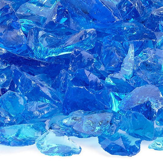 Close up of Turquoise Medium tempered fire pit glass showing bright turquoise decorative glass pieces with reflective shine