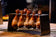 Load image into Gallery viewer, Festavolo Chicken Leg Rack holding chicken legs for grilling
