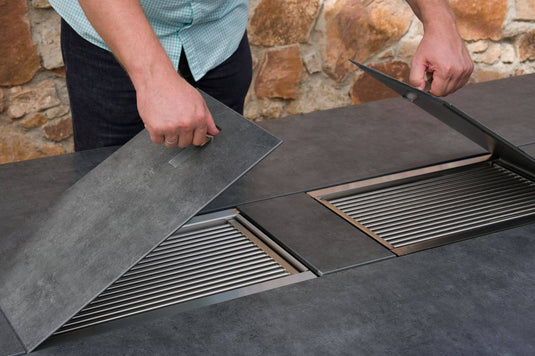 Festavolo FORTE GRANDE Notte dining grill table with cover plate being placed over the grill