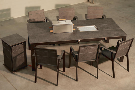 Festavolo FORTE HPL patio chairs arranged around the FORTE  MEDIO dining grill table
