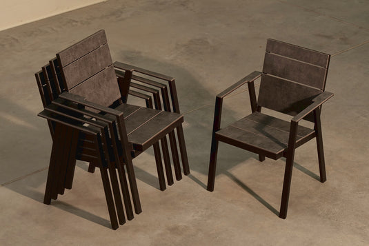 Stackable Festavolo FORTE HPL patio chairs neatly stacked for space-saving storage
