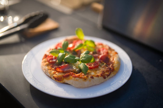 Festavolo Pizza Oven cooking pizza on a Festavolo grill table