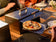 Load image into Gallery viewer, Festavolo Pizza Peel lifting a freshly baked pizza
