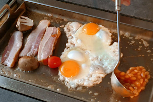 Eggs cooking on the Festavolo Stainless Steel Plancha