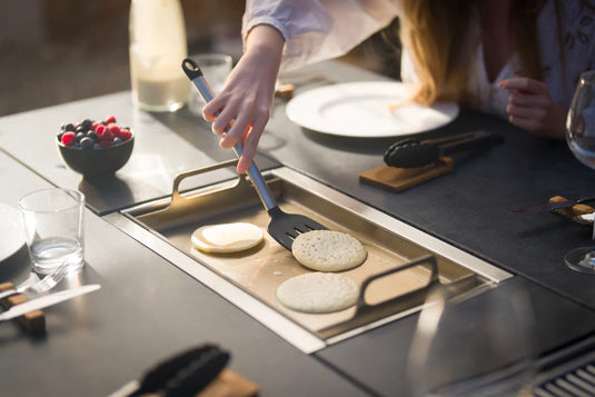 Festavolo Stainless Steel Plancha cooking pancakes on a grill unit