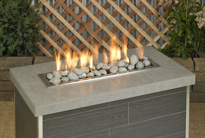 Load image into Gallery viewer, Fireplace linear lite stones in cape grey finish with visible flame, modern ceramic fire media arranged in a linear gas fireplace for indoor and outdoor fire features.
