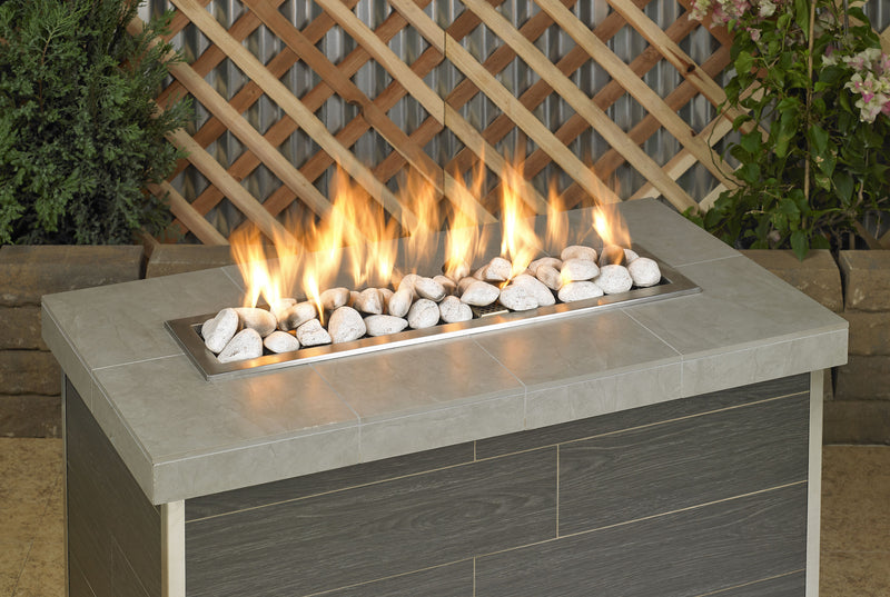Load image into Gallery viewer, Cottage white linear lite stones in a fireplace with visible flames creating a warm, cozy, and elegant fire feature display
