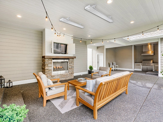 HEATSTRIP Classic White with Remote and App heaters ceiling mounted above a covered patio seating area