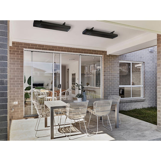 HEATSTRIP Enhance Black heaters ceiling mounted above a covered patio dining area