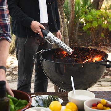 Looftlighter Classic starting charcoal in an outdoor kettle grill