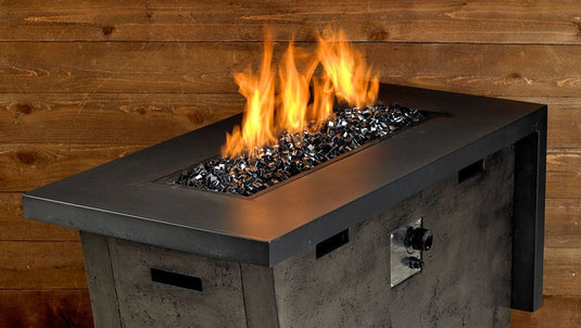 Modern outdoor fire pit featuring Black Luster 2.0 Fire Glass Cubes reflecting flames with a sleek luxury appearance
