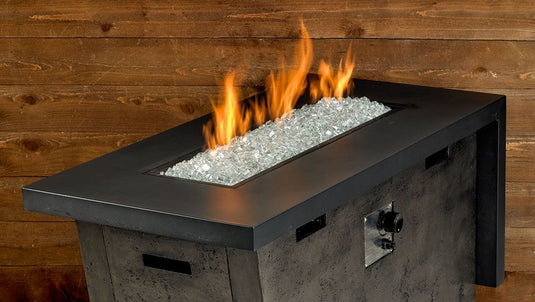 Luxury outdoor fire pit featuring Starfire Luster 2.0 Fire Glass Cubes with bright flames reflecting through clear glass cubes