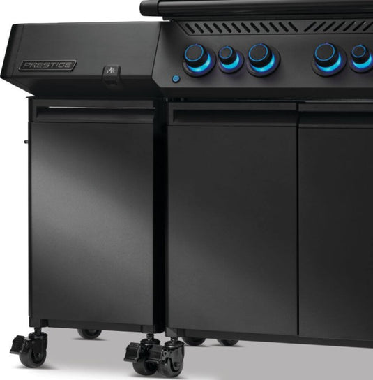 Napoleon 68004 matte black storage cabinet installed beside a Phantom Prestige gas grill with blue illuminated control knobs