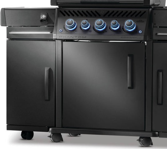 Close-up of Napoleon 68006 matte black storage cabinet installed beside a Phantom Rogue PRO-S grill with illuminated control knobs