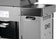 Load image into Gallery viewer, Rear detail of Napoleon 68009 Rogue PRO storage cart installation showing clearance for the grill grease tray access
