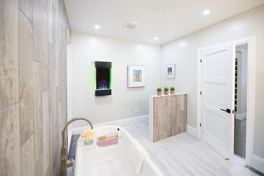 Napoleon Allure Vertical 32-inch electric fireplace mounted on a bathroom wall with green accent lighting
