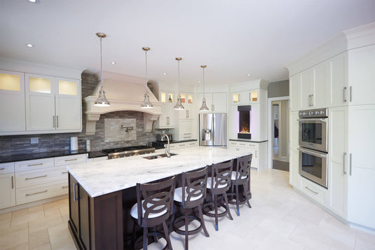 Napoleon Allure Vertical 38-inch wall-mounted electric fireplace installed in a modern white kitchen