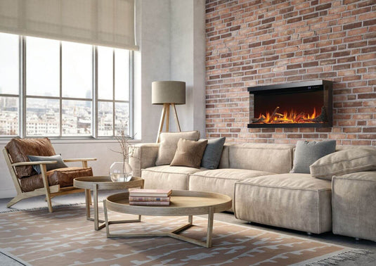 Napoleon Astound FlexMount 50-inch electric fireplace NEFL50AB wall-mounted on a brick accent wall above a beige sectional sofa.