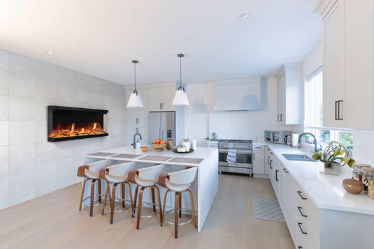 Napoleon Astound FlexMount 74-inch electric fireplace NEFL74AB wall-mounted on a tiled accent wall in a modern white kitchen with a center island.