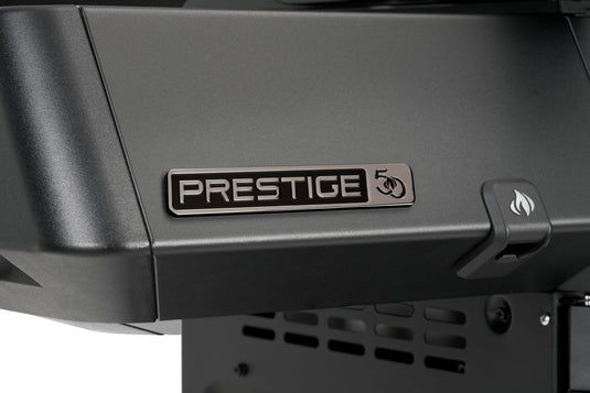 Close-up of the Prestige 50th anniversary badge on the black side shelf