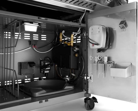 Open Napoleon Prestige PRO 500 cabinet with door-mounted rotisserie motor and forks