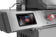 Load image into Gallery viewer, Close-up of Napoleon Prestige PRO 500 LCD showing indirect cooking mode beside a red illuminated knob
