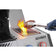 Load image into Gallery viewer, Steak held with tongs above the glowing infrared side burner on a Napoleon Prestige PRO 500
