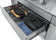 Load image into Gallery viewer, Napoleon Prestige PRO 665 Elite organized storage drawer holding cookware, utensils, and a towel
