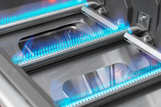 Napoleon Prestige PRO 665 Elite stainless steel gas burners operating with blue flames