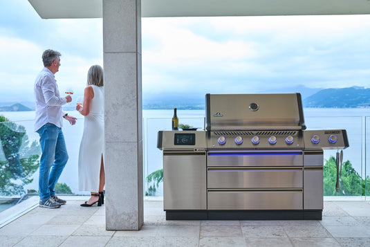 Napoleon Prestige PRO 665 gas grill with GAMA001 skirt kit installed in an outdoor patio setting