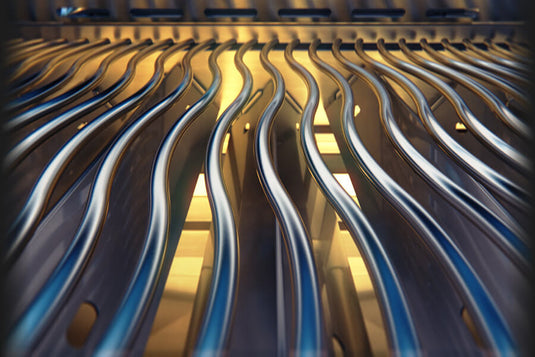 Close-up of metallic curved blades with a blurred background