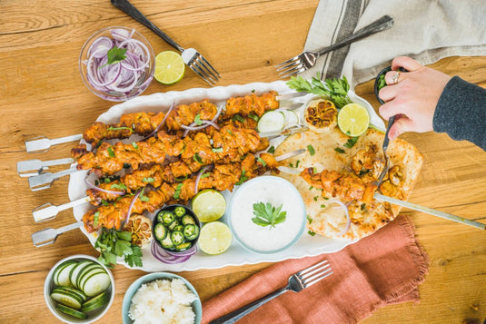 Napoleon Rotisserie Shish Kebab Skewer Set with 6 chrome skewers and 2 rotisserie plates