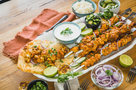 Napoleon Rotisserie Shish Kebab Skewer Set with 6 chrome skewers and 2 rotisserie plates