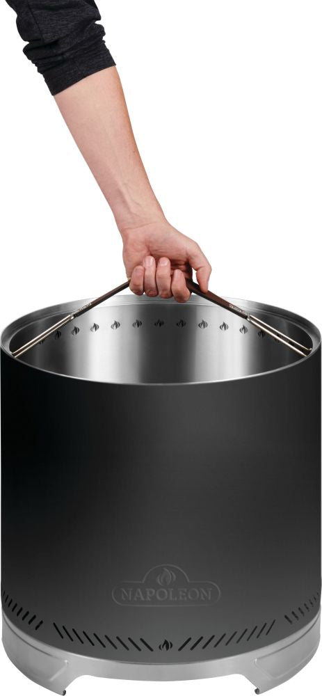 Napoleon Timberwolf 18-inch matte black smokeless fire pit being lifted using its carrying handle