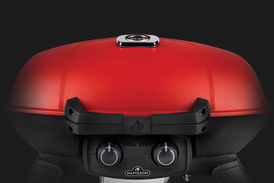 Napoleon TravelQ 285X red portable propane gas grill with scissor cart and reversible cast iron griddle, featuring 2 burners for versatile outdoor cooking