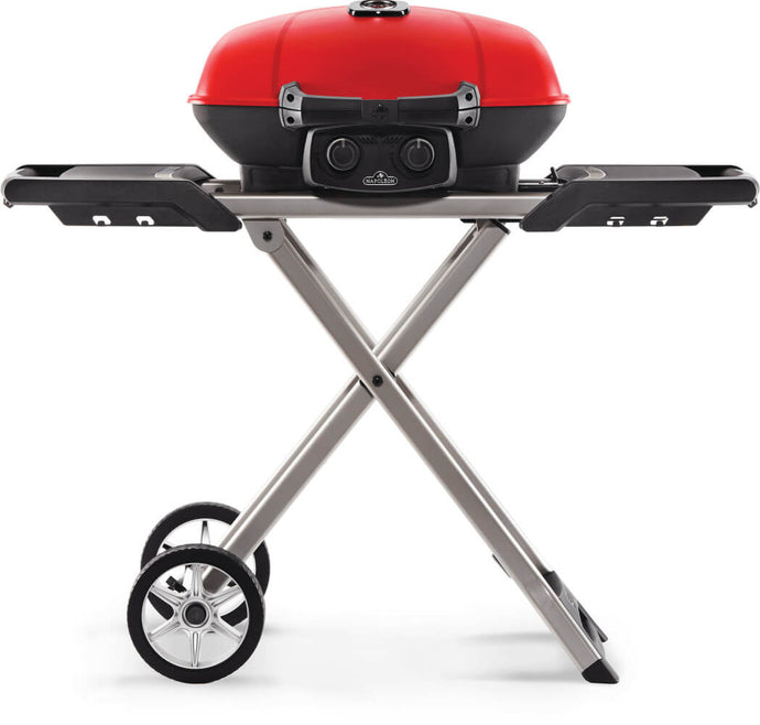 Napoleon TravelQ 285X red portable propane gas grill with scissor cart and reversible cast iron griddle, featuring 2 burners for versatile outdoor cooking