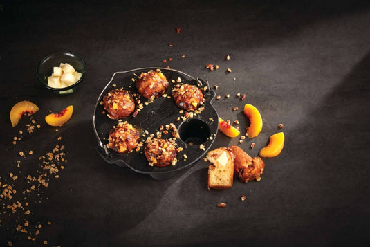 Napoleon cast iron muffin cooker with six compartments and easy-carry handle