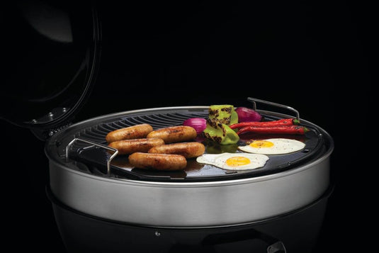 Napoleon cast iron reversible griddle for 22-inch charcoal kettle grill, showing flat and raised grilling surfaces