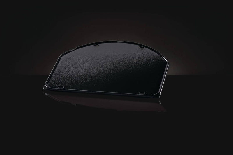 Load image into Gallery viewer, Napoleon cast iron reversible griddle for 22-inch charcoal kettle grill, showing flat and raised grilling surfaces
