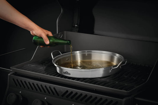 Napoleon Premium Chicken Infusion Roaster 3-in-1 set with wok, boiling plate, and infusion cone made of stainless steel for versatile grilling and roasting