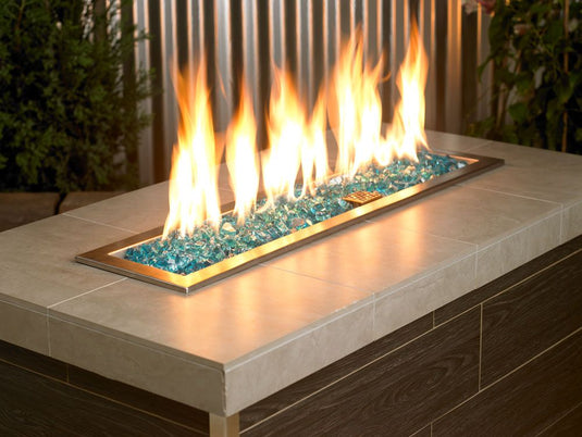 Outdoor fire pit filled with 1/2 inch Azuria Fire Glass producing vibrant flames and modern decorative appeal