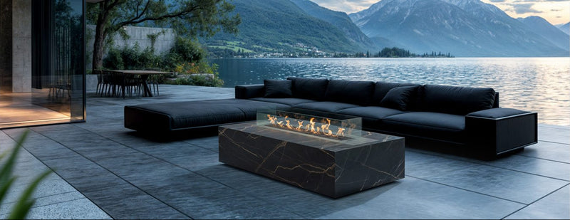 Load image into Gallery viewer, Planika Cabo Fire Table Laurent installed on a luxury outdoor patio with elegant flames
