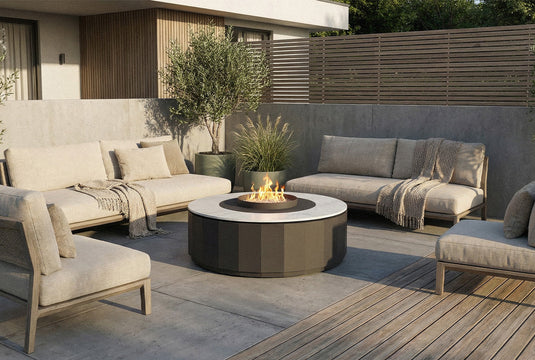 Planika Comet Fire Table Daze installed on a modern outdoor terrace with decorative flames