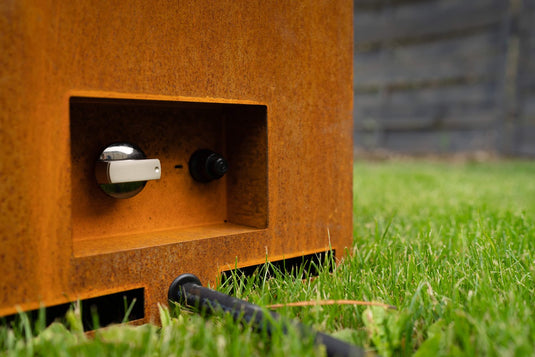 Close-up of Planika Galio Corten Manual outdoor gas fireplace