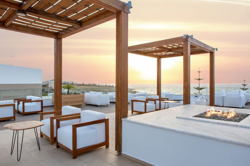 Load image into Gallery viewer, Planika Galio H Insert Automatic outdoor gas burner on a luxury patio at night
