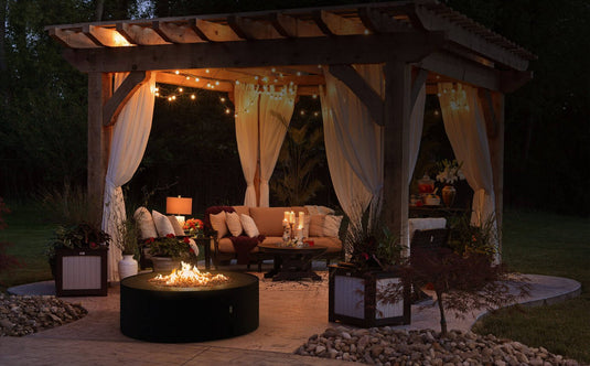 Planika Galio Star Black Outdoor Gas Fireplace in Modern Backyard Patio Lifestyle Setting