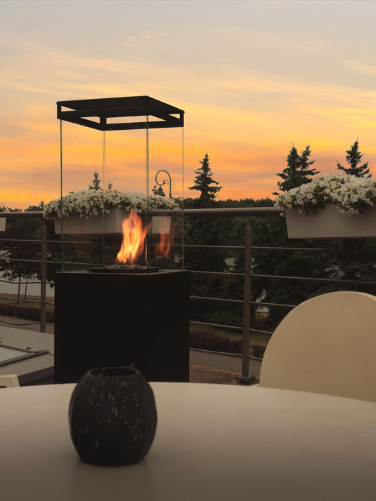 Planika Lighthouse gas patio heater in modern outdoor patio setting with warm flame ambiance